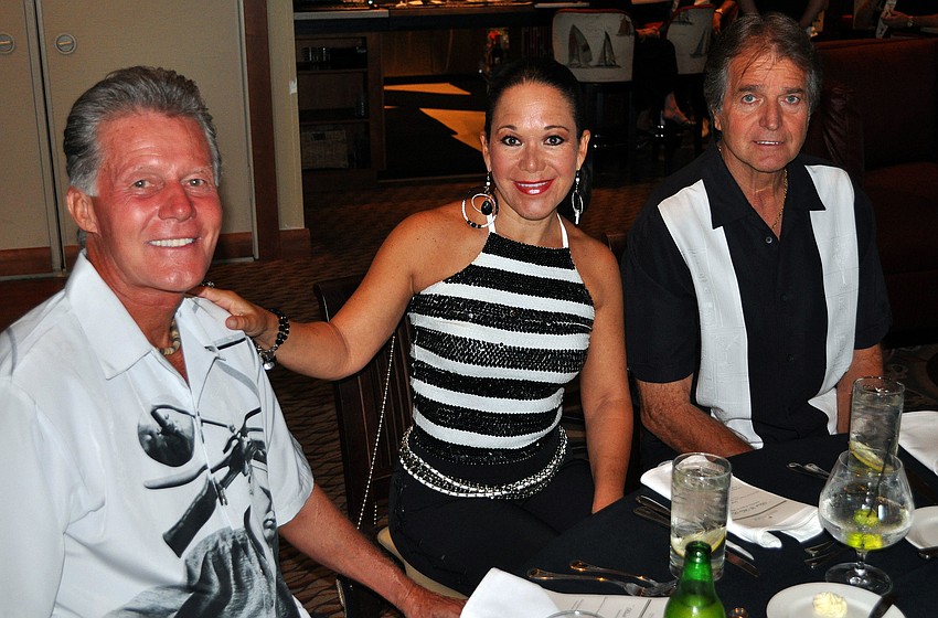 George and Sandra Ceshker and Harry Pawlowitz pose together at the SYC Black & White Ball Saturday, August 13 at the Sarasota Yacht Club.