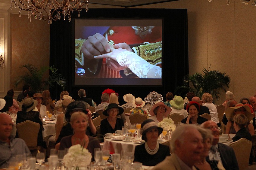 The crowd watches as Prince William put the ring on Kate Middleton's hand Friday, April 29 at the Ritz Carlton.
