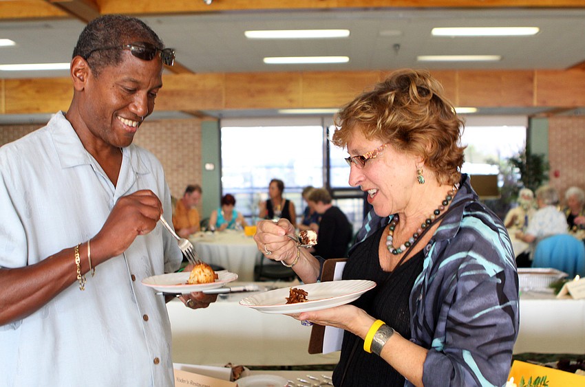 Walter Gavin and Rhonda Post, one of the dessert judges, enjoy some of the desserts during Family Promises' Third Annual Just Desserts event Friday, May 20 at Selby Garden's Great Room by the Bay.