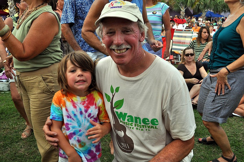 Brittin Sullivan, 3 Â½, poses with his grandfather, Michael Rowe, Friday, July 15 at Friday Fest at the Van Wezel.