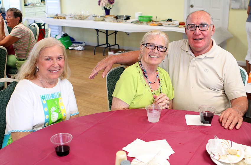 Marge Wiegmann poses with Ellen and Jim Shields Saturday, July 16 at the Christ Church and Spanish Main fish fry.