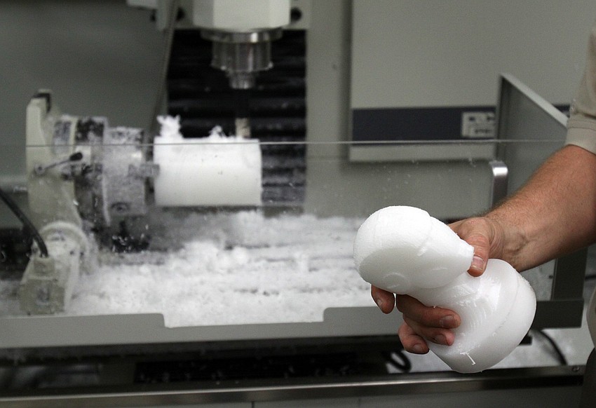 Eric McGrath, Fab Lab Foreman, shows off a wax creation made in the Fab Lab.