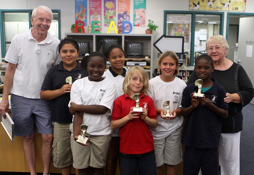 George Kenworthy and Iris Wilson, the main bridge coaches for Gocio's bridge club, stand with the top bridge club participants, Marco Trejo, Reyana Robinson, Jamilah Walker, Hunter DeSerio, Joey Worthley and Charles Brantley.