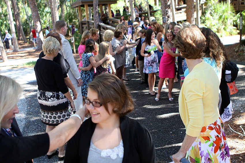 Lower School teachers made two lines on either side of the walk way down from Siesta Key Chapel in order to personally congratulate all the kids Friday, June 3 after ODA's 6th grade graduation at Siesta Key Chapel.