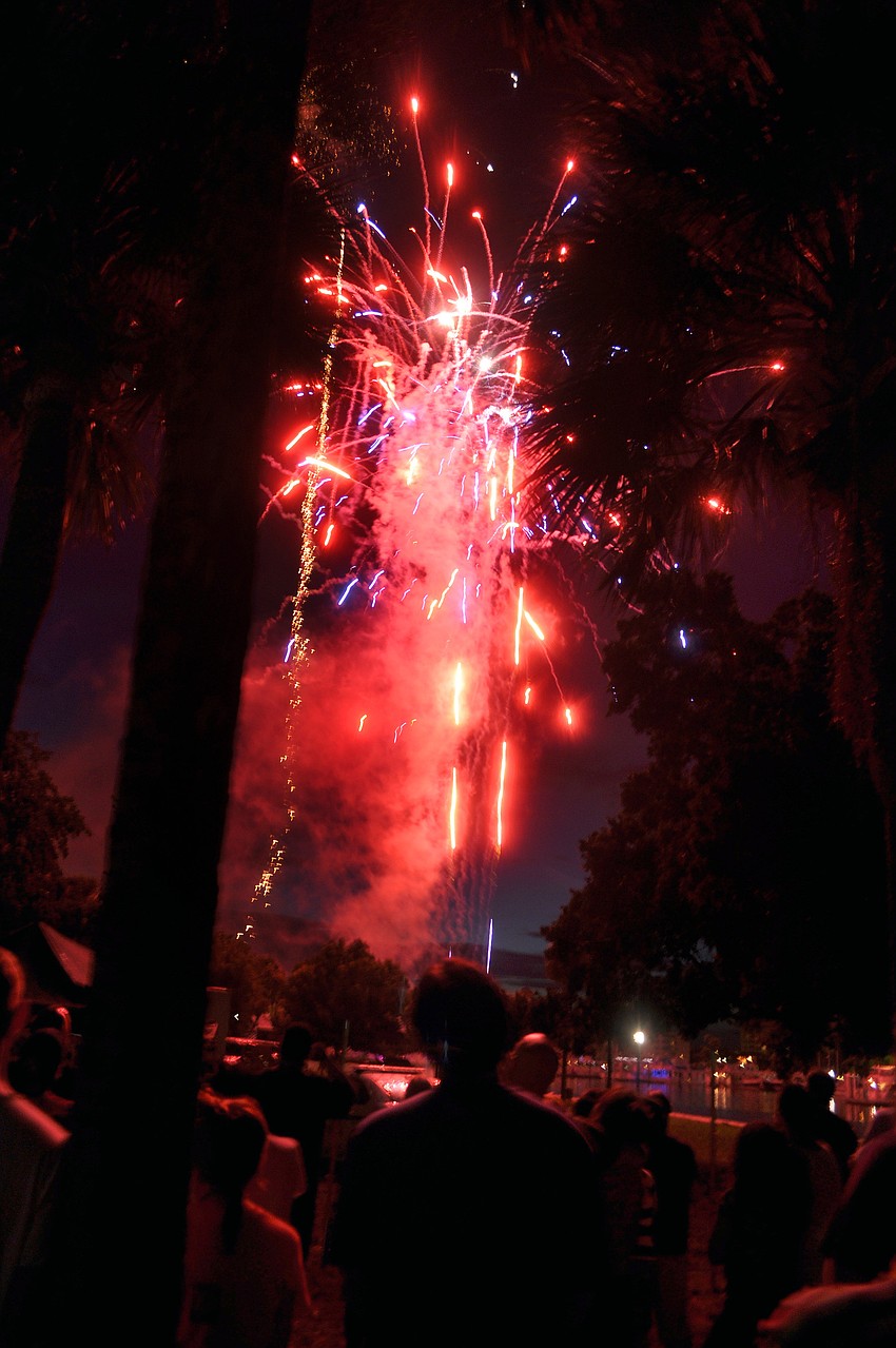 Smoky red, blue and gold light up the night during the Bayfront Fireworks Spectacular Monday, July 4 at Island Park.