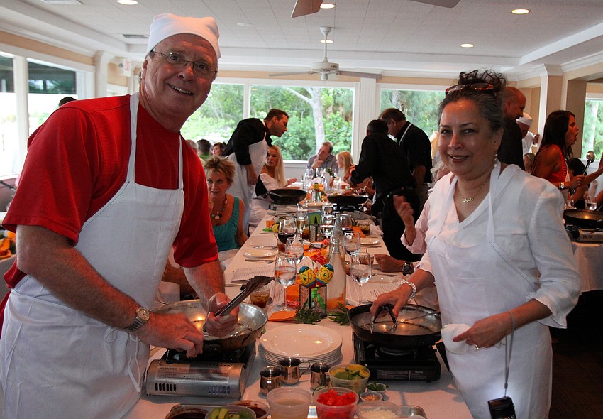 Jeff Porterfield and Nazeela Shaw get ready to cook Friday, July 22 during the Interactive Mexico dinner at Pattigeorgeâ€™s.