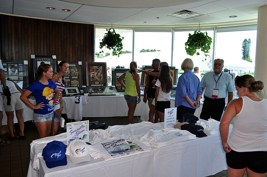 Many people took some time looking and bidding on some of the items in the silent auction Saturday, August 6 during the Sarasota Slam weigh-in at Marina Jackâ€™s.