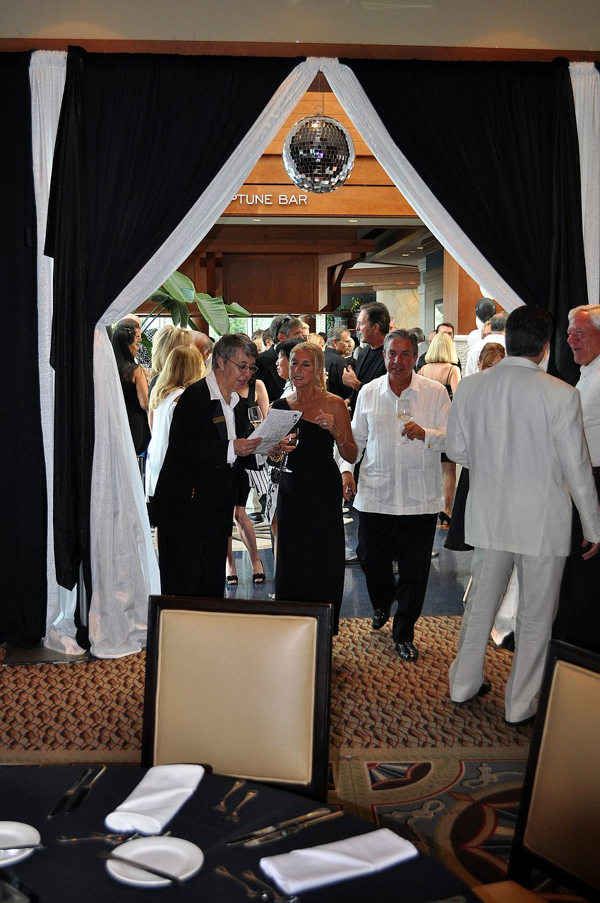 The entrance to the dining room included a disco ball and black and white curtains.