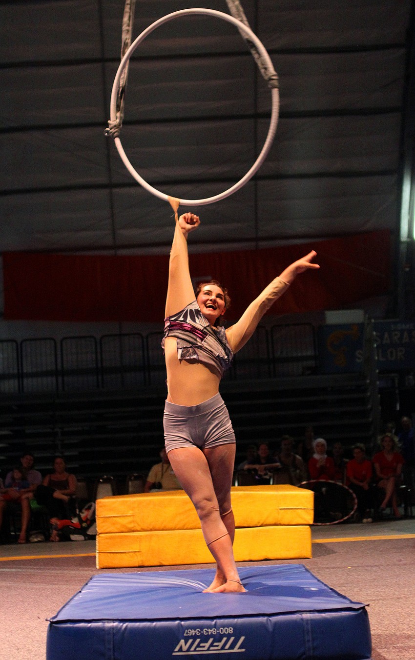 Greylin Nielsen, of Circus Smirkus of Greensborough, VT, smiles and tries to bow after her costume got caught in her hoop at the end of her act Thursday, Aug. 18 inside the PAL Sailor Circus Arena.