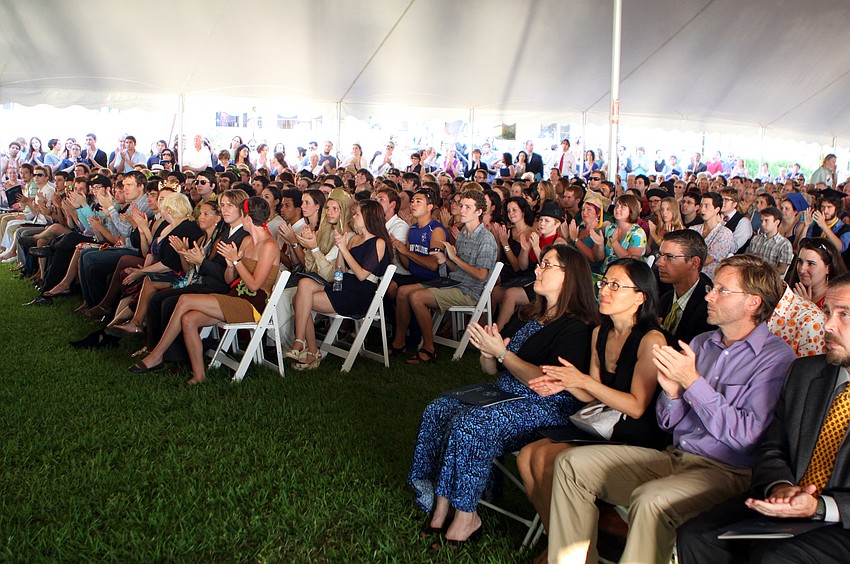 Students, parents and staff applaud for President Gordon E. 