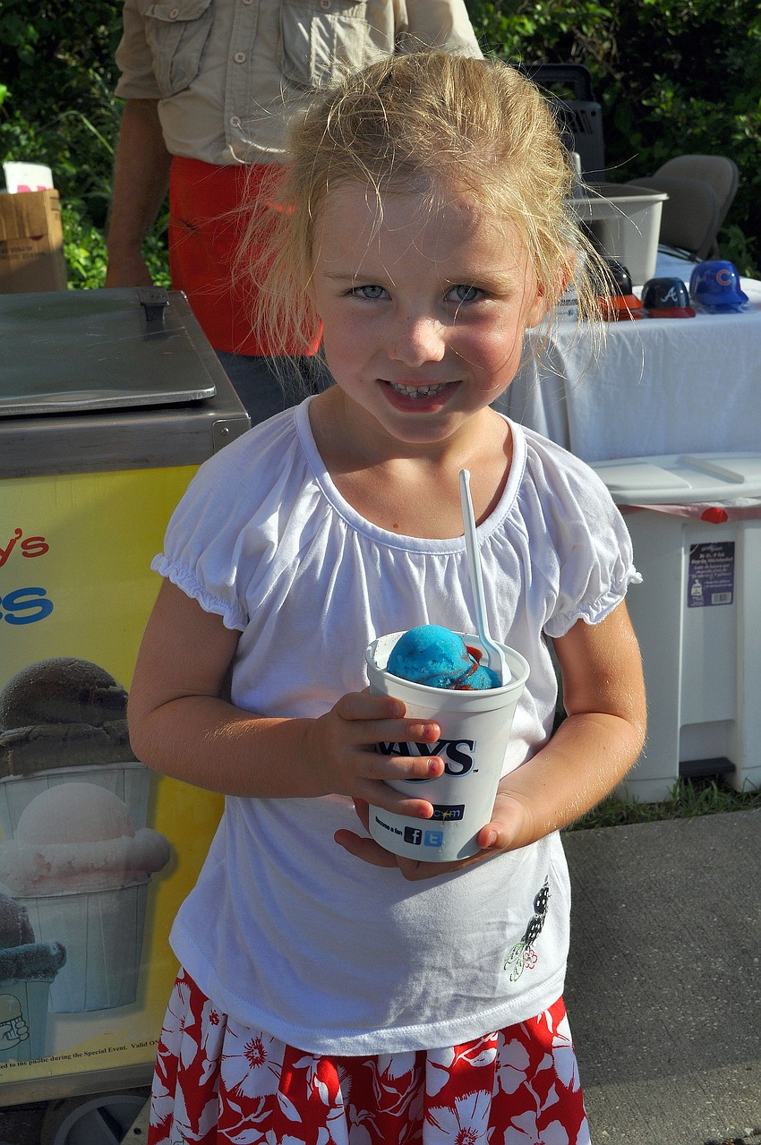 Aubrey Robbins, 5, poses with her red and blue Italian ice.