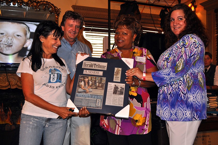 A framed grouping of articles about Barbara Strauss and the Blues Festival was given to Strauss by Aundria Castleberry and Nicole Double Saturday, August 13 during the Kick Off Party at the Gator Club.