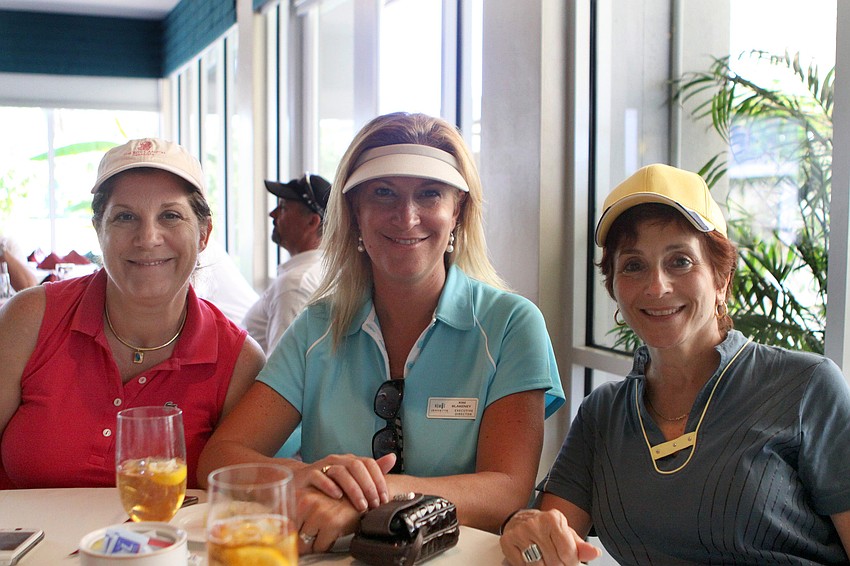 Lisa Rotolo, Kim Blakeney and Annette Colabella of Jennette Properties volunteered by driving some of the beverage carts during the 2011 Longboat Key Invitational Friday, May 27 at the Longboat Key Club Islandside.