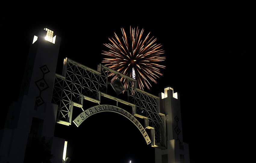 A firework goes off over the Sarasota Bayfront archway during the Bayfront Fireworks Spectacular Monday, July 4 at Island Park.
