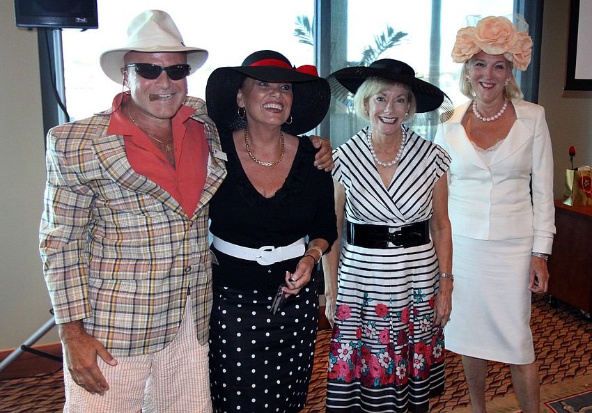 Jes Santaularia, winner of the Wacky Suit contest, poses with Linda Page, Kathy Pokoik and Jennifer Goichman, the judges, on Saturday, May 7 at the Kentucky Derby party at the Sarasota Yacht Club.
