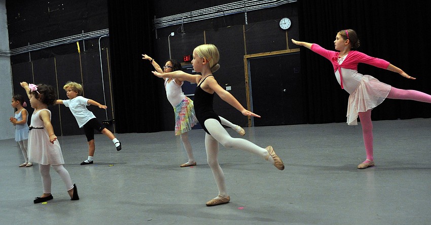 Young ballerinas work on their routine during a summer camp class run by the Sarasota Ballet at the Asolo Repertory.