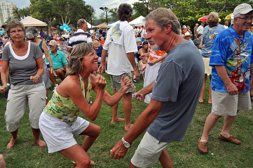Cynthia and Keith Wilson get into the music Friday, July 15 at Friday Fest at the Van Wezel.