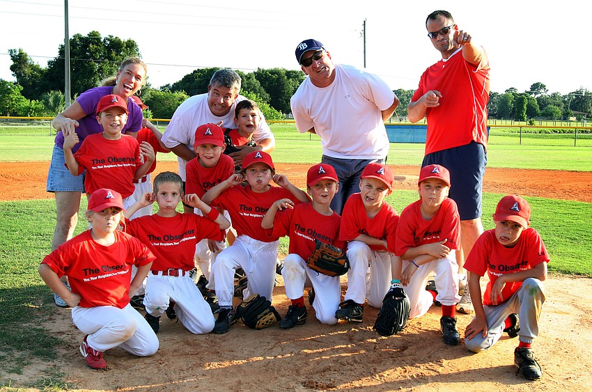 The Observer coach pitch team makes silly faces after their final game of the Spring season Monday, May 9 out at Twin Lakes Park.