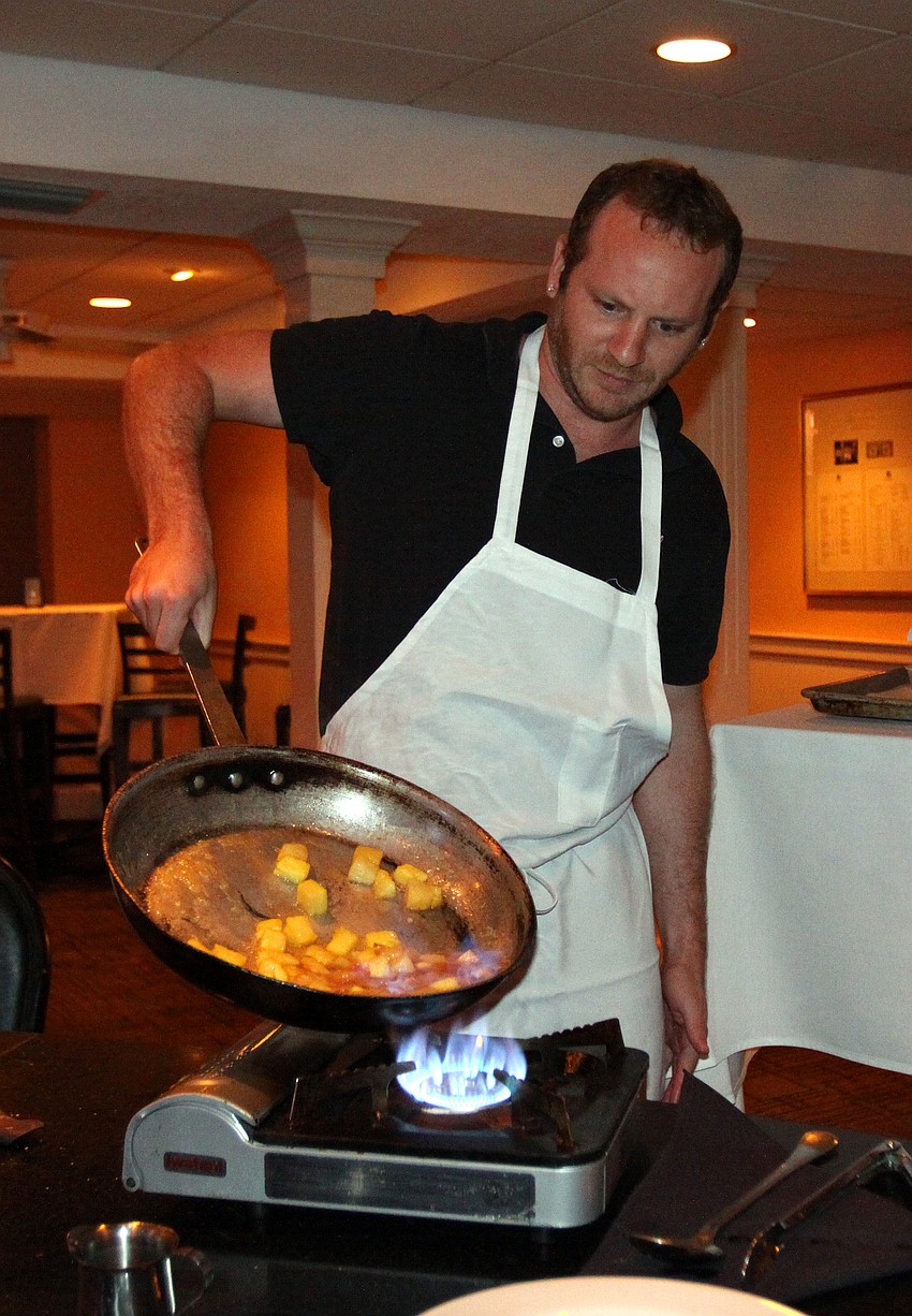 Adam Schiffman has fun flambÃ©ing the dessert course Friday, July 22 during the Interactive Mexico dinner at Pattigeorgeâ€™s.