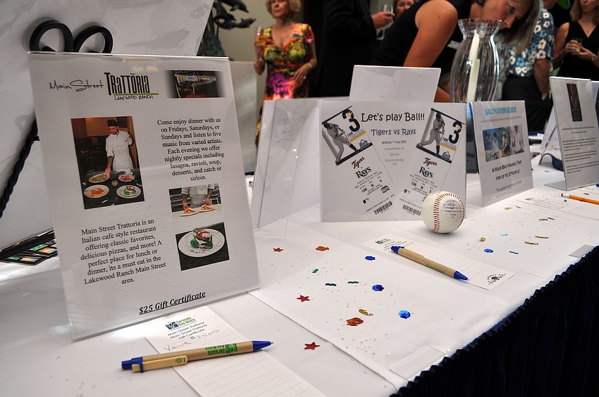 There were plenty of items to bid on at the silent auction Saturday, August 6 during Scallopalooza at the Sarasota Yacht Club.