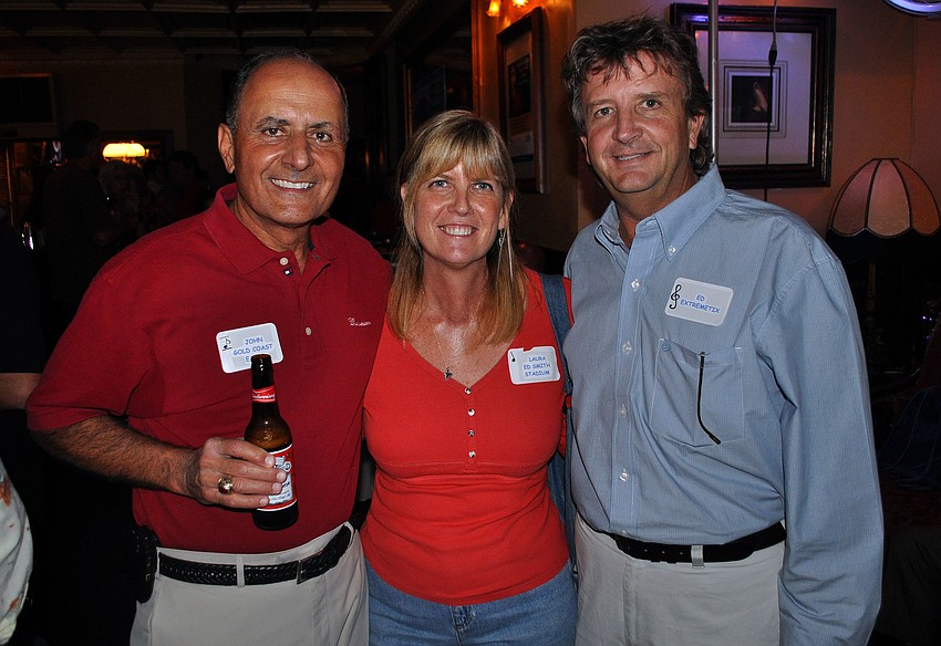 John Saputo, Laura Williams and Ed Morrell pose together Saturday, August 13 during the Kick Off Party at the Gator Club.