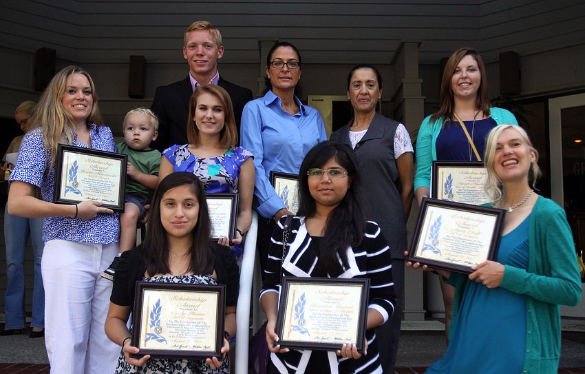 The winners of the Kiwanis academic scholarships pose together Thursday, Aug. 18 on the steps by The Grill.