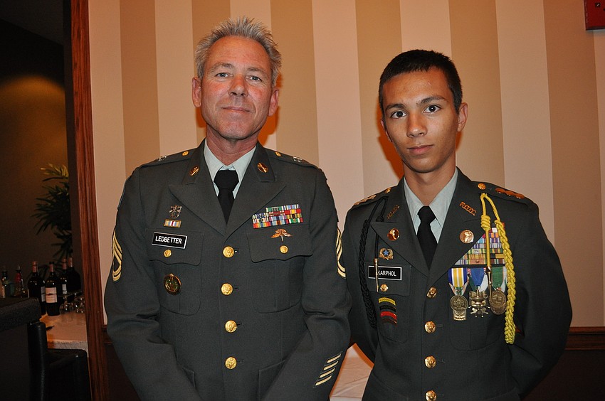 Sfc. John Ledbetter with Cadet David Skarphol of Booker High School.