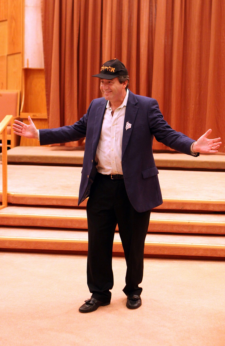 Rabbi Katz shows off his Orioles hat that is says 