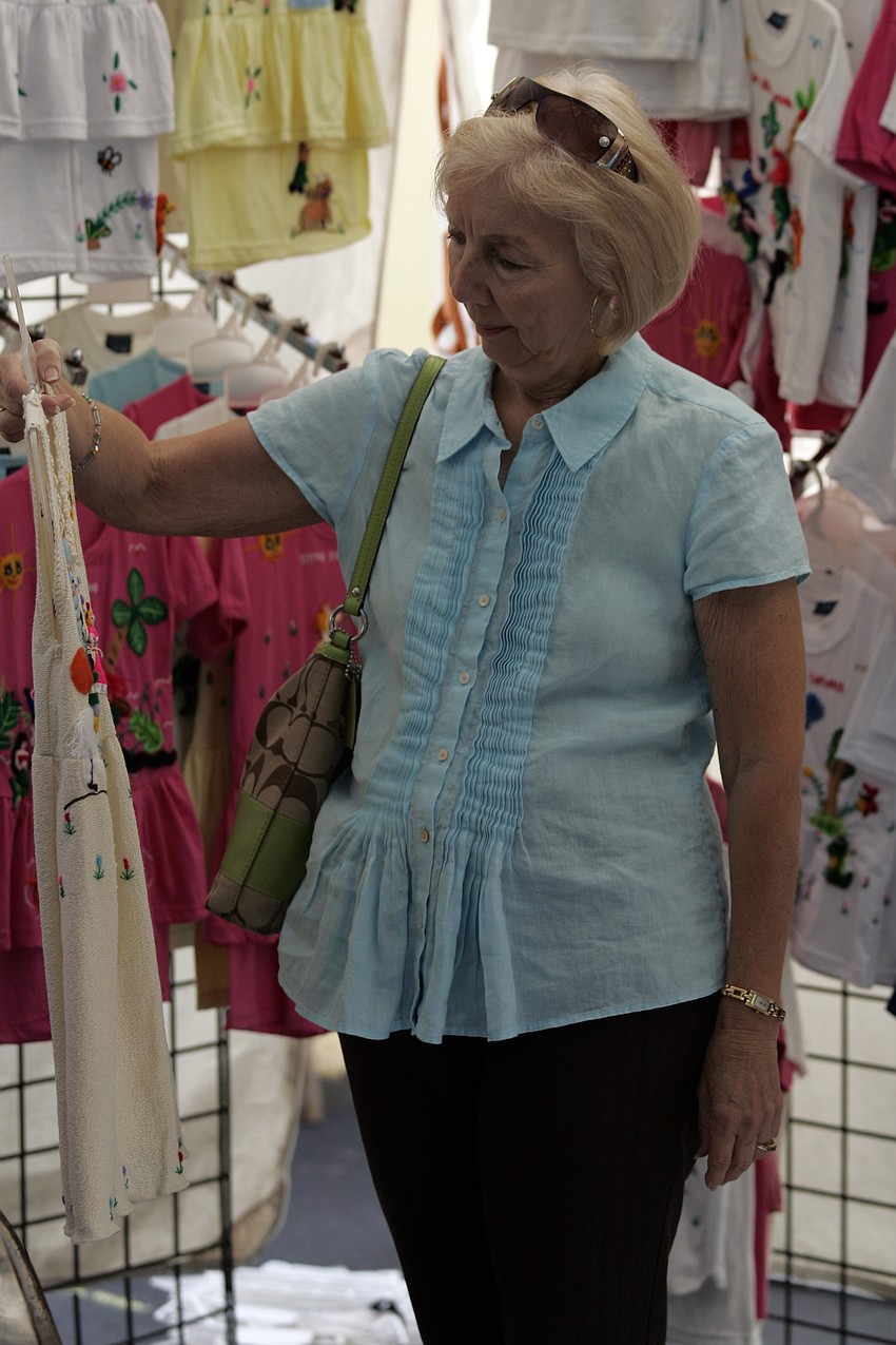 River Club resident Pat Hearne picked out a dress for her granddaughter's upcoming birthday.