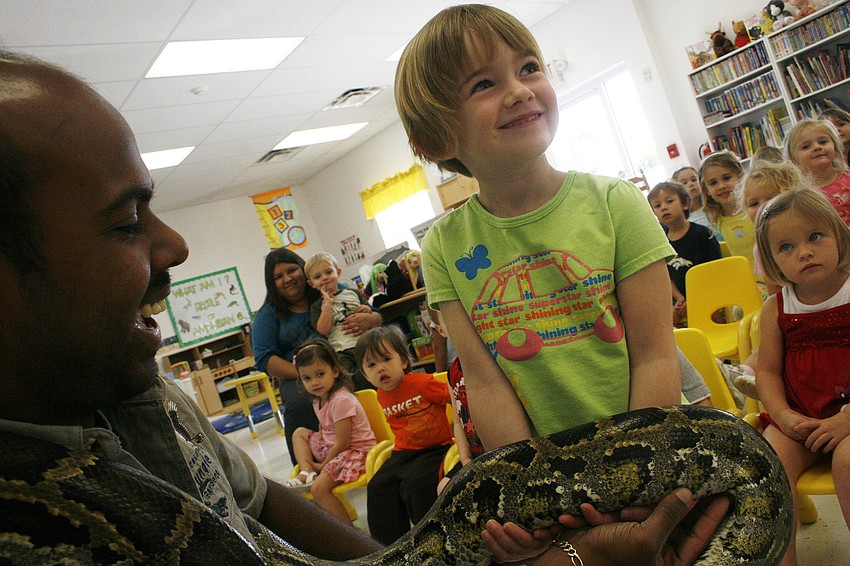 Isabelle Walker loved petting the python's scaly body.