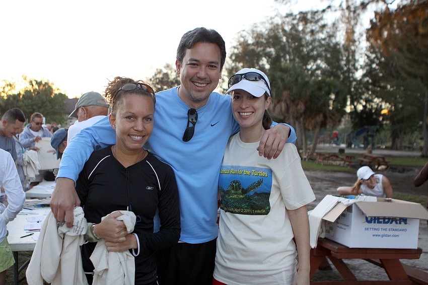 Meghan Jones, Chris Takeda and Jennifer Best pose together before running on Saturday, April 2 in the 25th Annual Run for the Turtles on Siesta Key Beach.