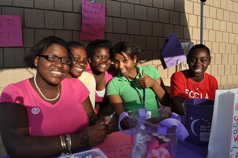Yavonne Bain, Dasia Parker, Daphney Viljean, Jayme Haynes and Ariel Collins sold bracelets, rubber ducks and more to raise money for cancer research.