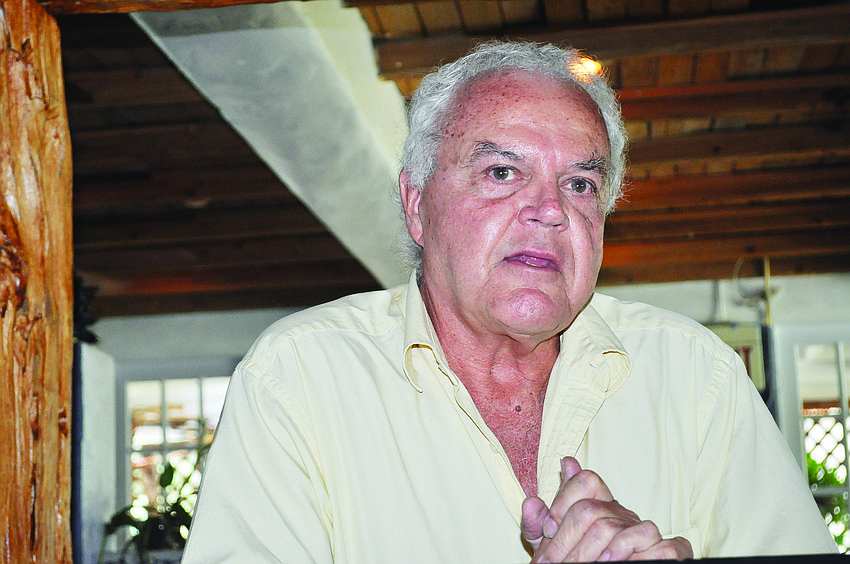 Author James Macomber speaks.