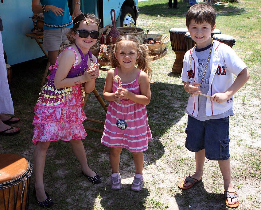 Gabriella Gregory, 6, Ares Brill, 3, and Jackson Gregory, 6, play with some fun drums and other rhythm instruments brought by The Rhythm Inlet to play during the Earth Day Celebration on Sunday, April 17 out at Oscar Scherer State Park in Osprey.