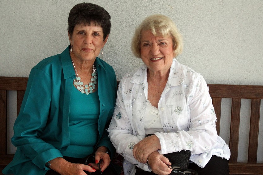 Nancy Cobin and Ruth Robinson catch up outside Temple Emanu-El prior to going inside to celebrate Passover and have Seder dinner.