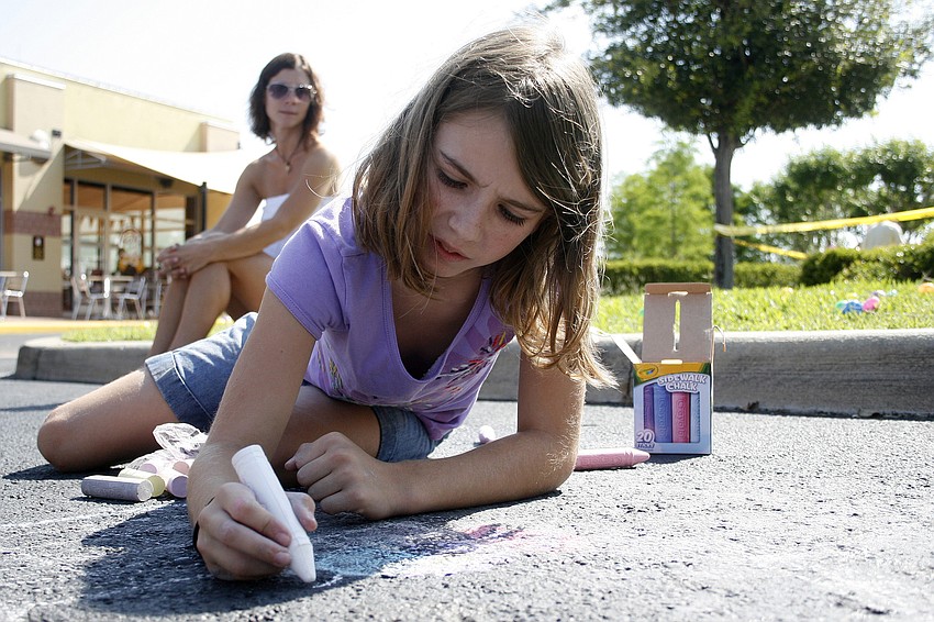 Anna Brosnihan, 9, worked hard on her sidewalk chalk art project.