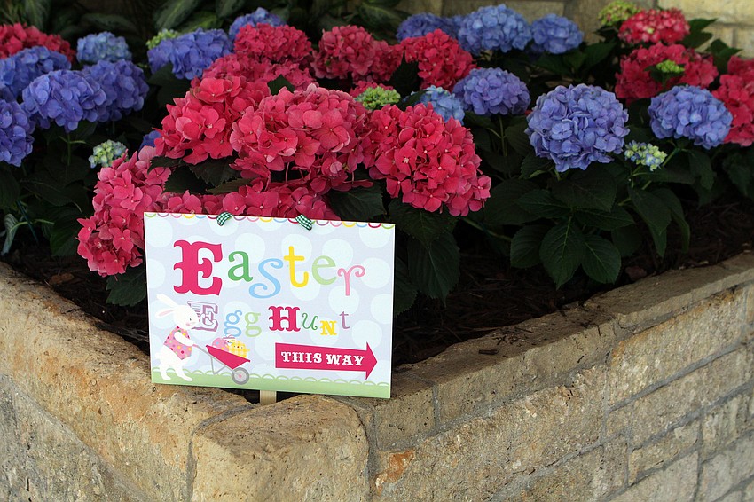 A sign pointed towards the Easter egg hunt Sunday, April 24 at Bird Key Yacht Club.