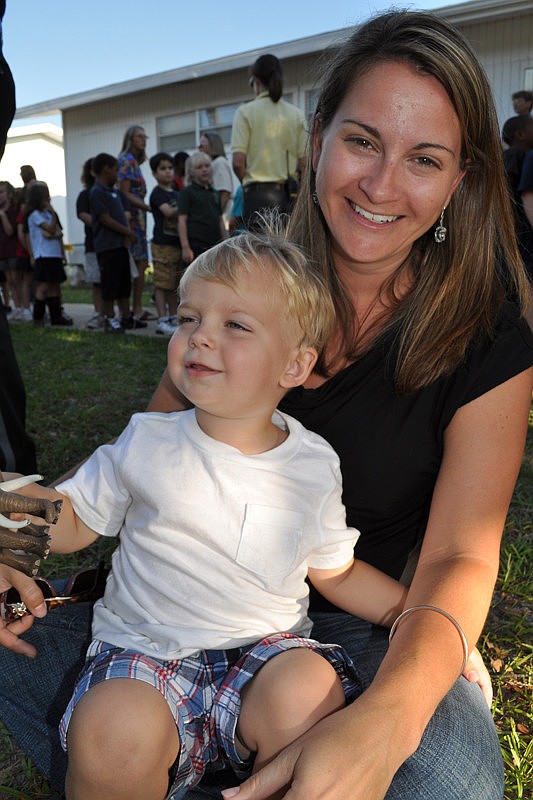 Langdon Bennett, with his mom Larissa, was eager to see his dad, Principal Joshua Bennett.
