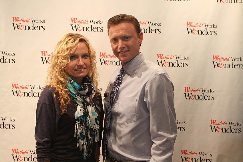 Banana Republic manager Deborah Waggoner poses with Westfield Southgate marketing director Sam Davidson Thursday, April 28 at the Paint the Town Blue event.