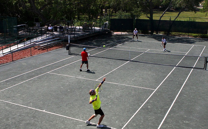 John Beeman serves to Jim Long on Wednesday, April 27 during the Longboat Key Tennis Center's 2011 Spring League championships.