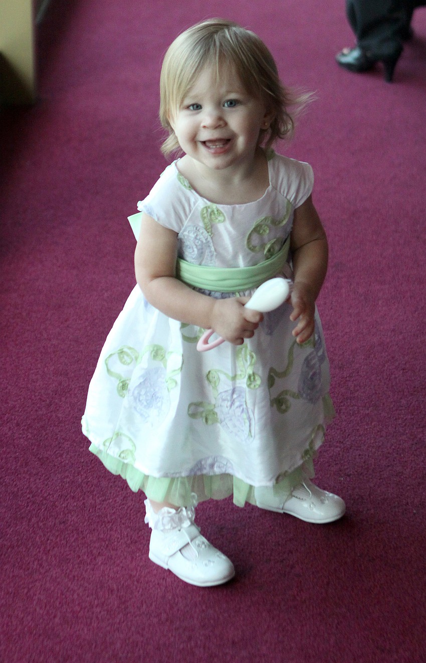 Madeline Perrotta, 13 mos., enjoys running around inside the Van Wezel on Friday, April 29 during the 10th Annual Education Celebration.