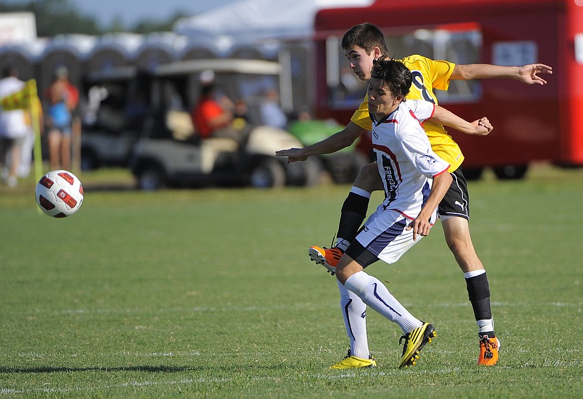 Florida Fusion's Zack Mine fights a Florida Soccer Alliance U17 player for postion.