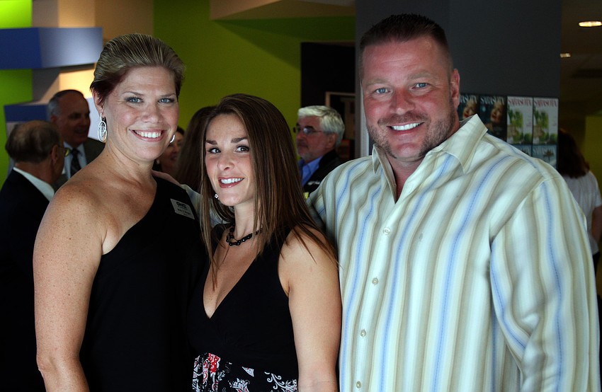 Molly Morgan, CEO of G. WIZ, poses with Wendy and Shawn Crane at the opening of the G. WIZ Faulhaber Fab Lab Thursday, May 5 at G. WIZ.