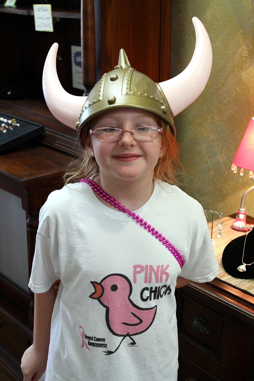 Emily Birney, 8, was dressed up in Breast Cancer attire as part of Pillage the Village fundraising event Friday, May 6 at various locations throughout Southside Village.