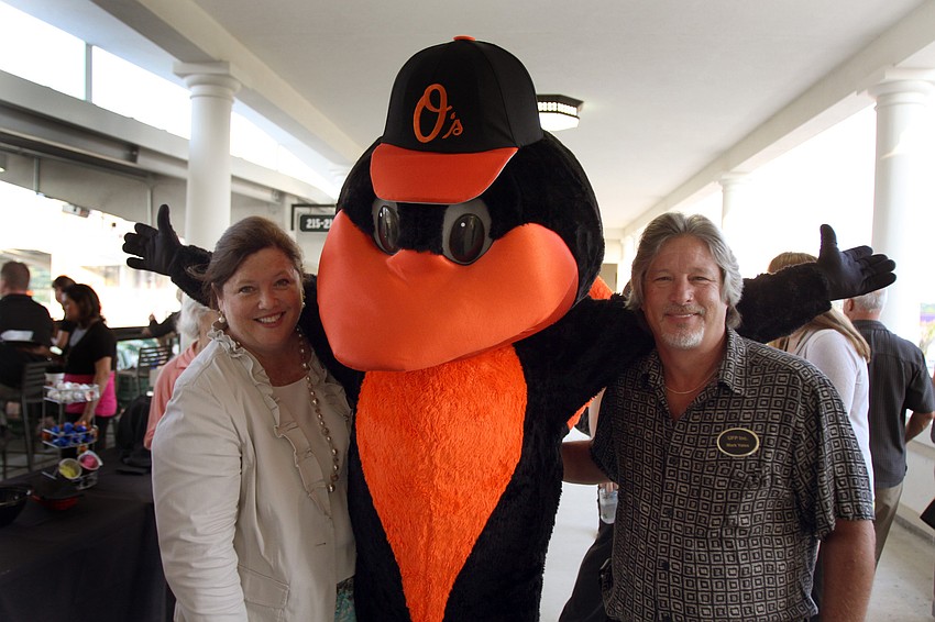 Stephanie Grosskreutz and Mark Yates pose with The Bird at the 2011 National Tourism Week Awards ceremony Thursday, May 12, at Ed Smith Stadium.