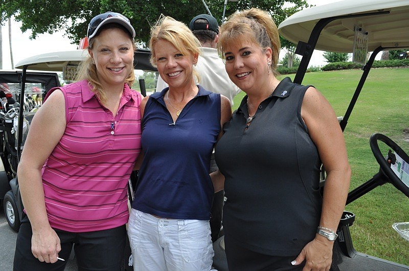 Nicole Brown, Amy Mann and Amy Hochleutner golfed with Atlas Solutions.
