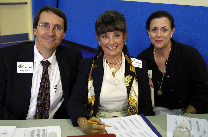 Spelling bee judges Kraig Koach and Dorothy Stuart with reader Jacki Boedecker at the Sarasota Kiwanis Club's Spelling Bee Friday, May 13 at the Boys and Girls Club.