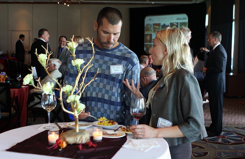 Trent Hink and Viktorija Bulava enjoy sipping wines and trying food from Spain, India and Thailand Tuesday, May 17 during the 