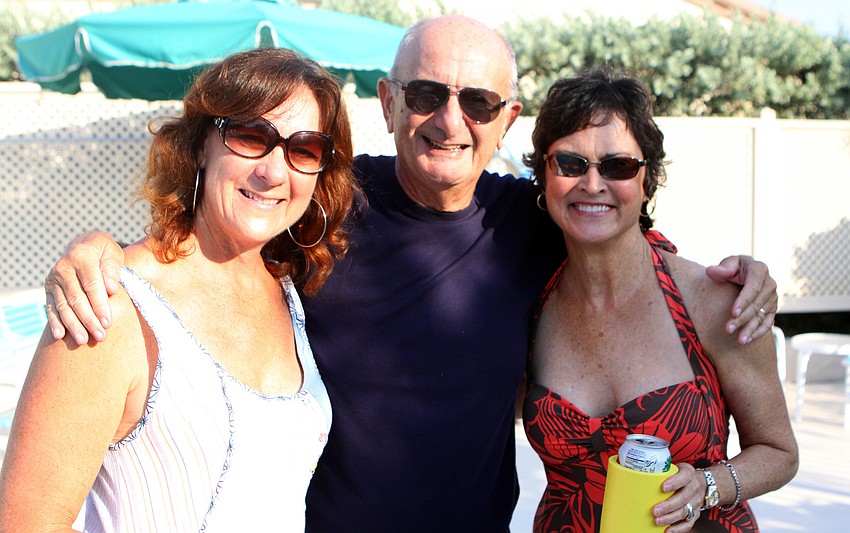 Roger Driben poses in between Beverly St. Hilaire and Gayla Schwartz at Harbour Circle's End of Season BBQ Sunday, May 22 at the pool.
