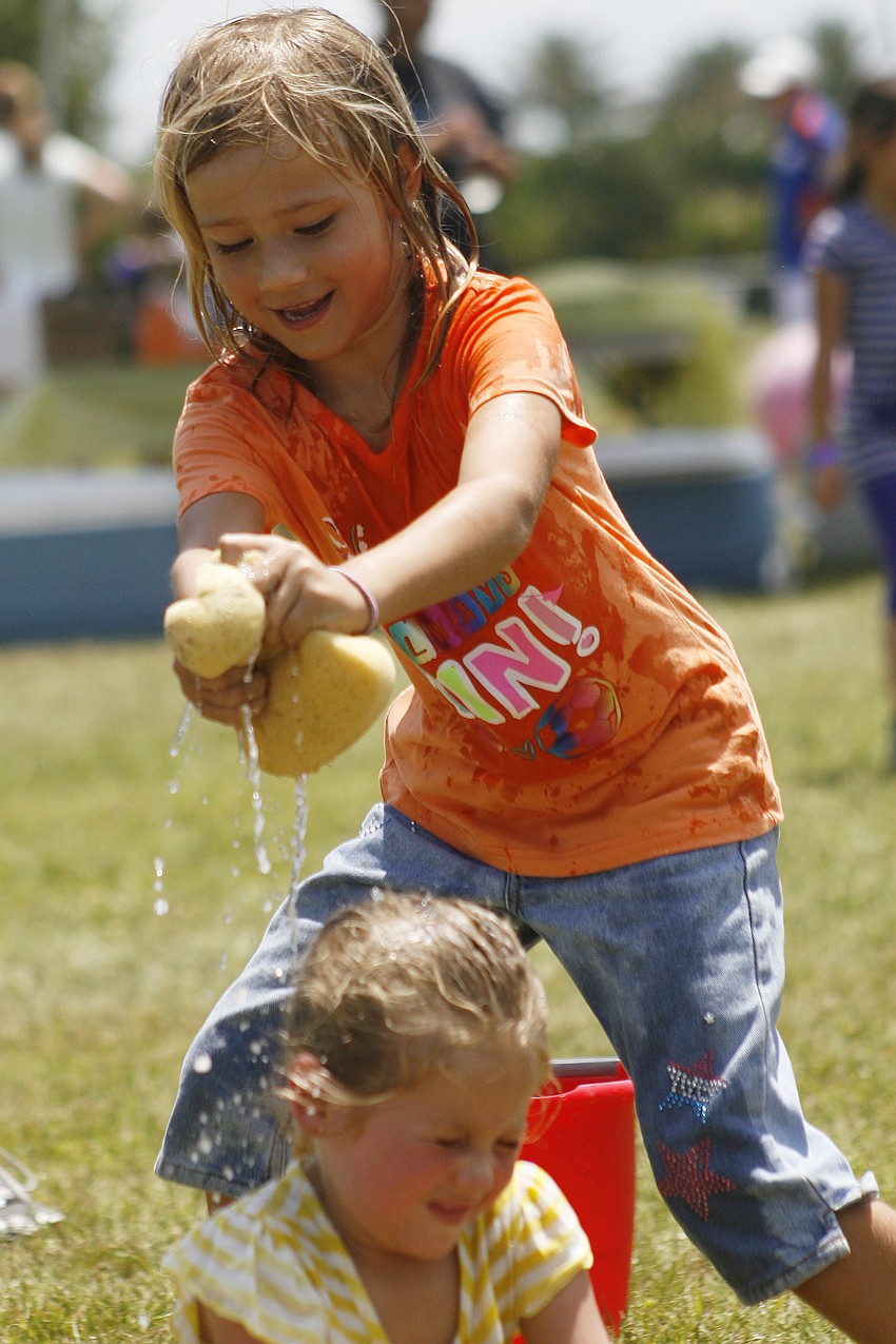 Bella Warmbie, 6, selected her opponent in Duck Duck Goose by squeezing a wet sponge on her head.